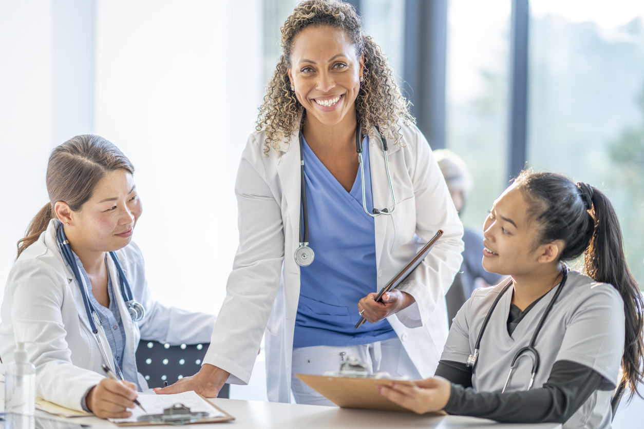 Nursing Unit Manager With Other Nurses in a Health Care Facility.