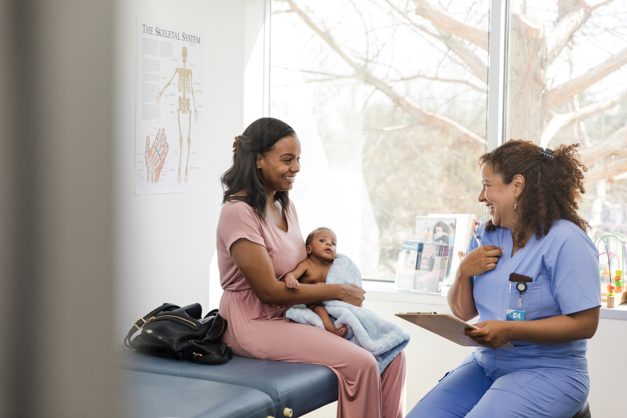 A Family Nurse Practitioner Smiling With Patients
