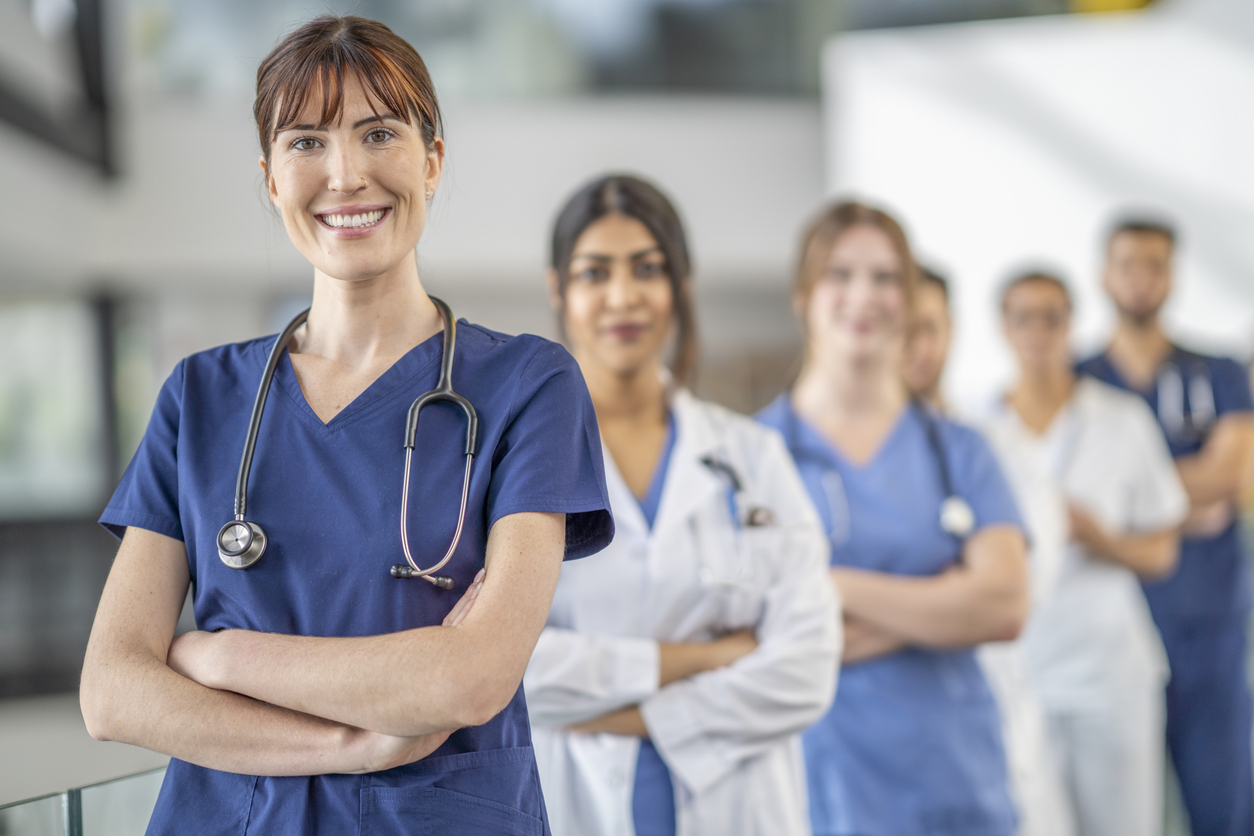 Nurse Leader With Medical Staff Members in a Hospital.