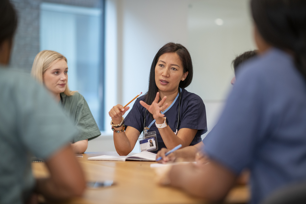 A Nurse Manager Talks With Their Nursing Team