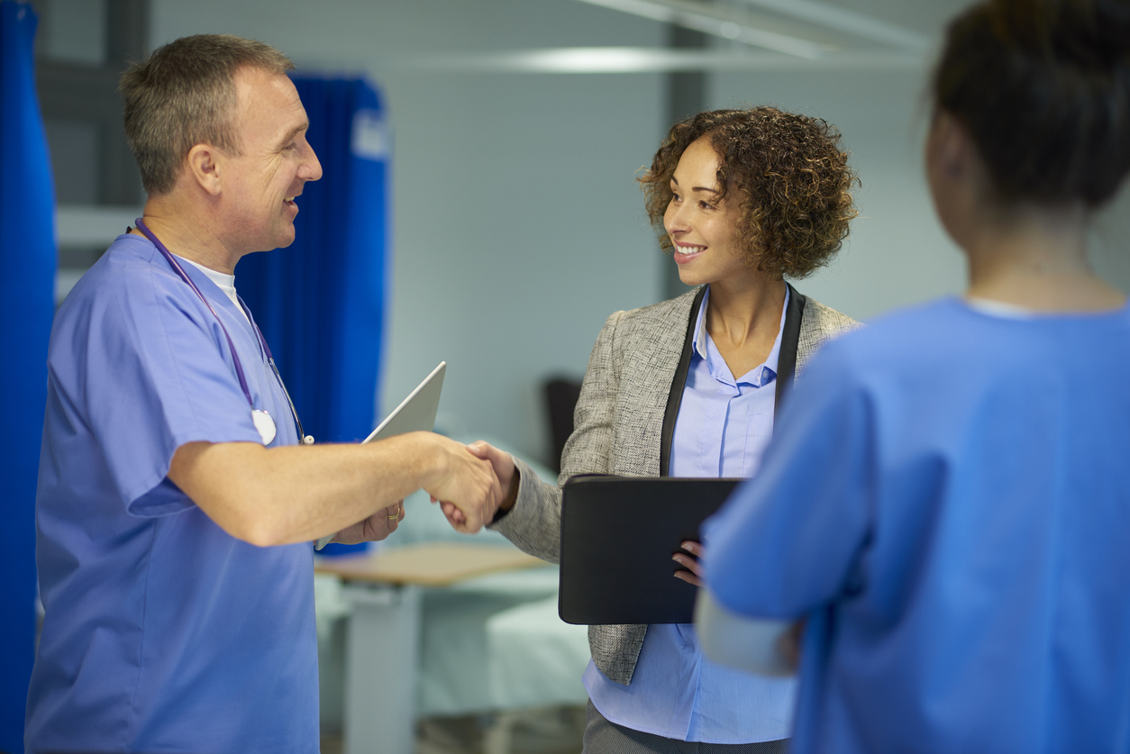 Nurse Meeting With a Public Health Professional in a Medical Facility.